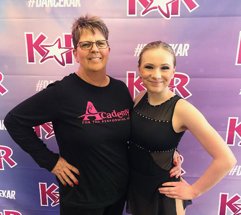 Deb Stacy standing with a dancer